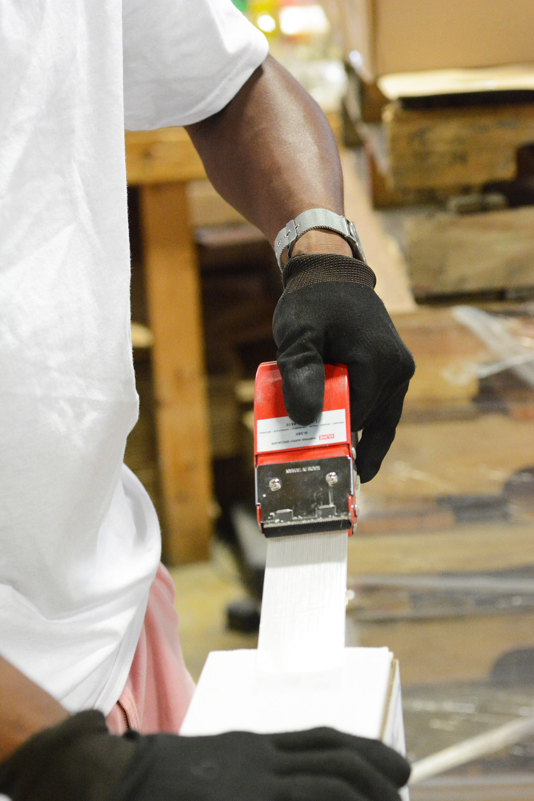 Vernon Johnson taping a box